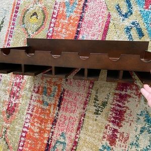 Pier 1 wine shelf with wine glass slots.